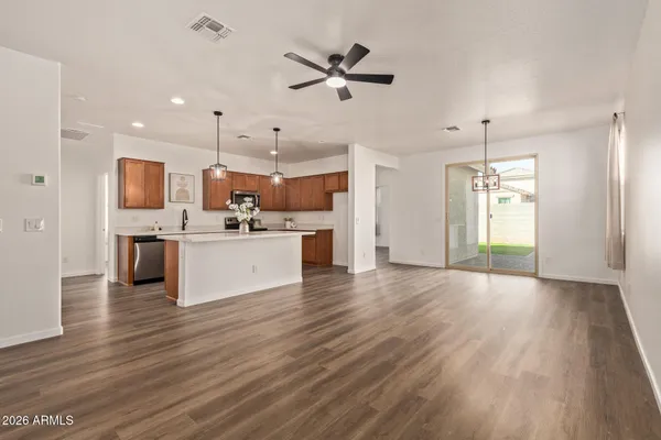 a view of kitchen with cabinets stainless steel appliances a sink and a window