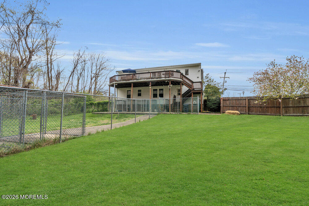34 State Route Colts Neck, NJ 07722 - Photo 33 of 40 a view of a house with a big yard and a large tree