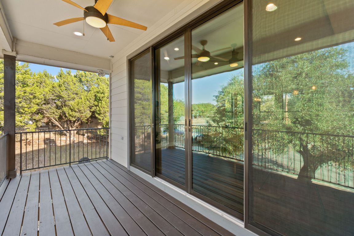 418 Summit Ridge Drive North Lago Vista, TX 78645 - Photo 20 of 40 a view of a room with wooden floor and windows