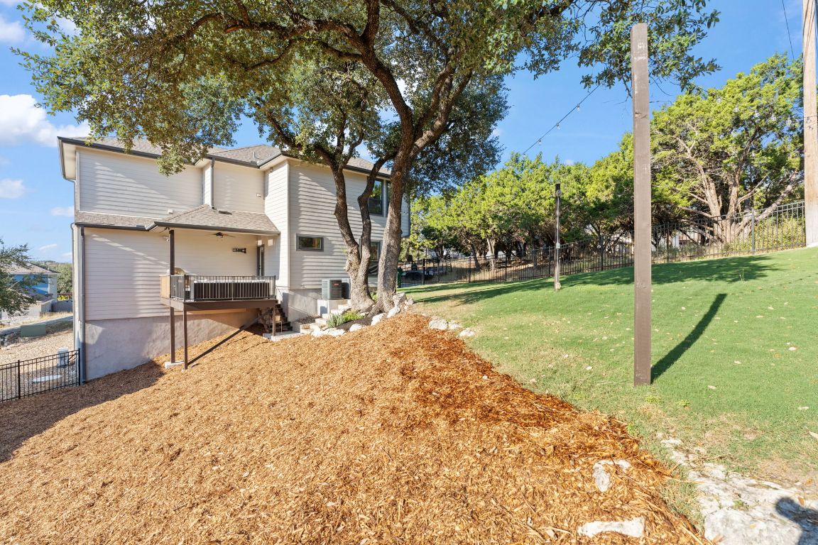418 Summit Ridge Drive North Lago Vista, TX 78645 - Photo 37 of 40 a house view with a backyard space