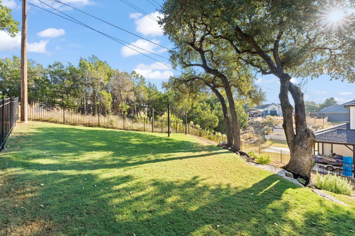 418 Summit Ridge Drive North Lago Vista, TX 78645 - Photo 39 of 40 a view of a yard with large trees