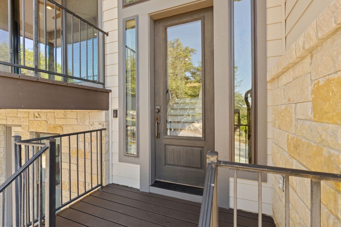 418 Summit Ridge Drive North Lago Vista, TX 78645 - Photo 4 of 40 a view of a balcony with wooden floor