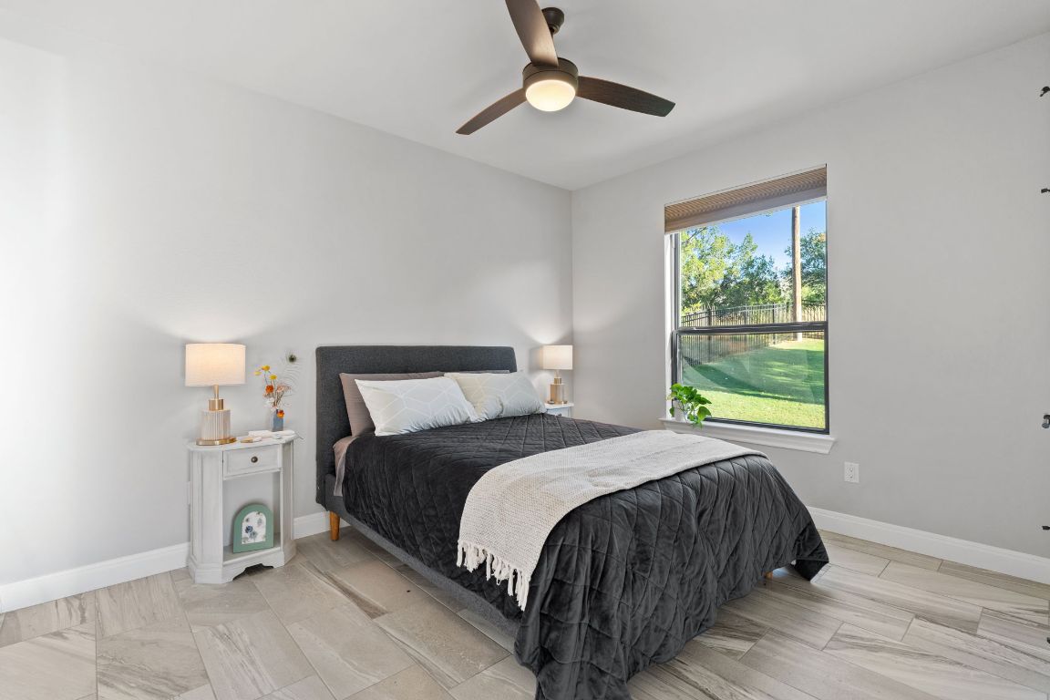 418 Summit Ridge Drive North Lago Vista, TX 78645 - Photo 6 of 40 a bedroom with a bed and a window
