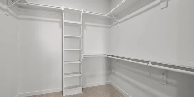 a view of an empty walk in closet