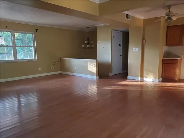 a view of a livingroom with wooden floor