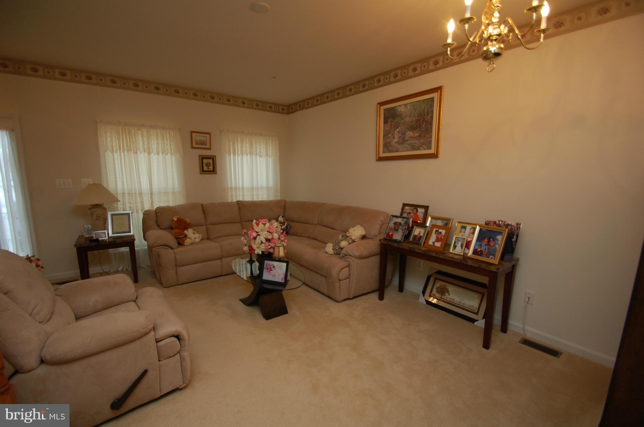 1954 Waltman Road Edgewood, MD 21040 - Photo 2 of 11 a living room with furniture and a chandelier