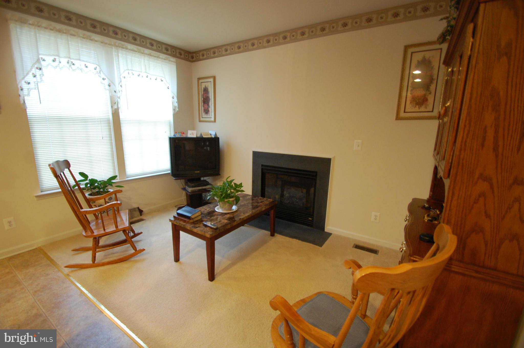 1954 Waltman Road Edgewood, MD 21040 - Photo 4 of 11 a living room with furniture and a fireplace