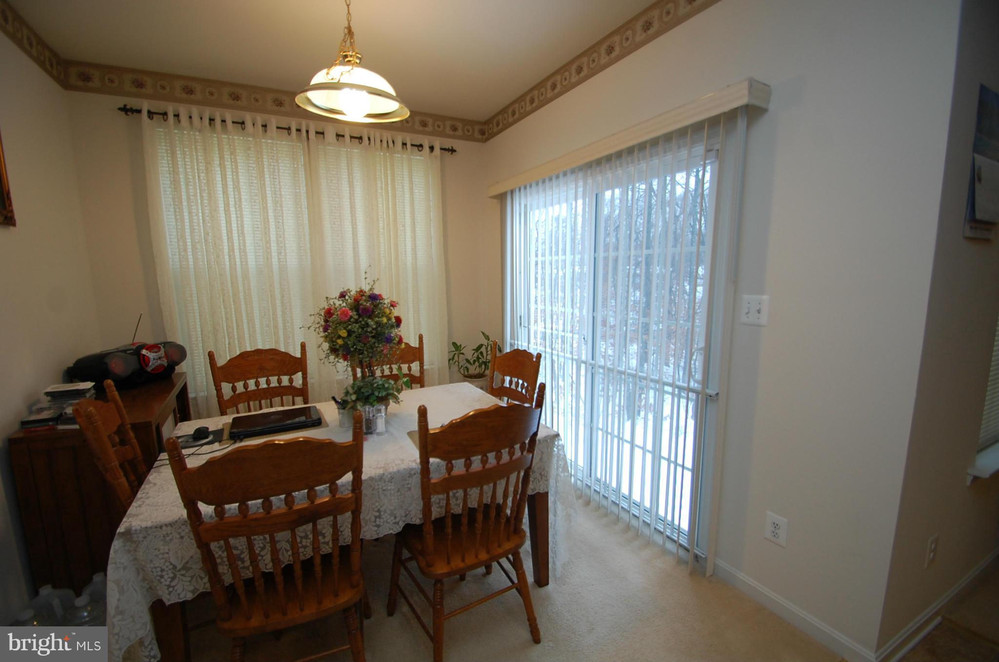 1954 Waltman Road Edgewood, MD 21040 - Photo 5 of 11 a view of a dining room with furniture window and chandelier