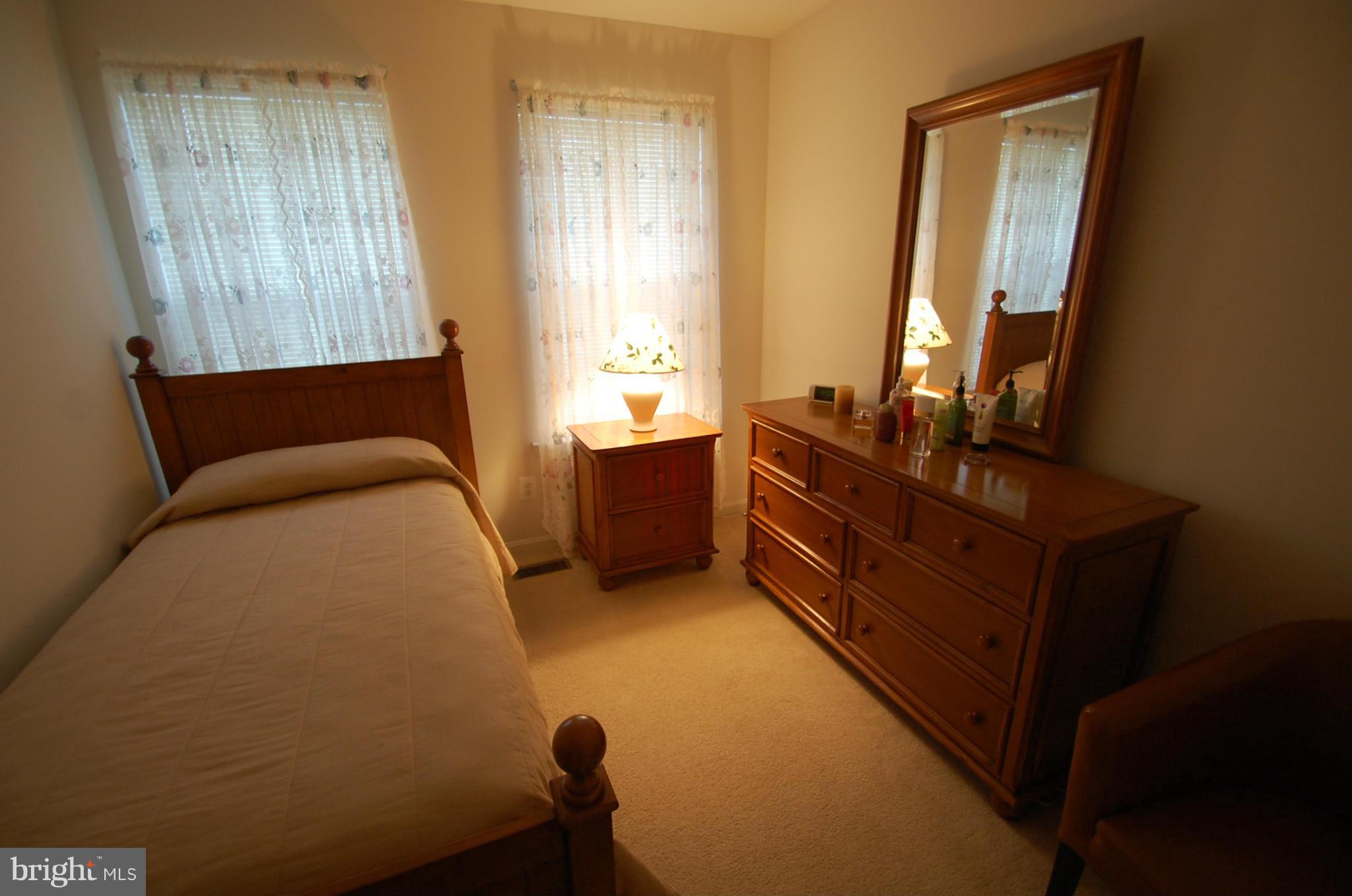 1954 Waltman Road Edgewood, MD 21040 - Photo 9 of 11 a bedroom with a bed and a dresser