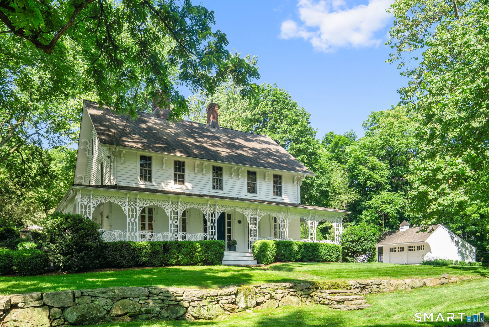 105 White Oak Shade Road New Canaan, CT 06840 - Photo 1 of 1 a front view of a house with garden