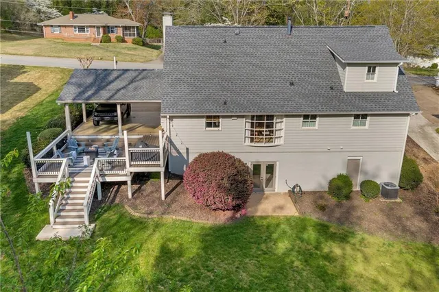 a living room with fireplace furniture and a flat screen tv