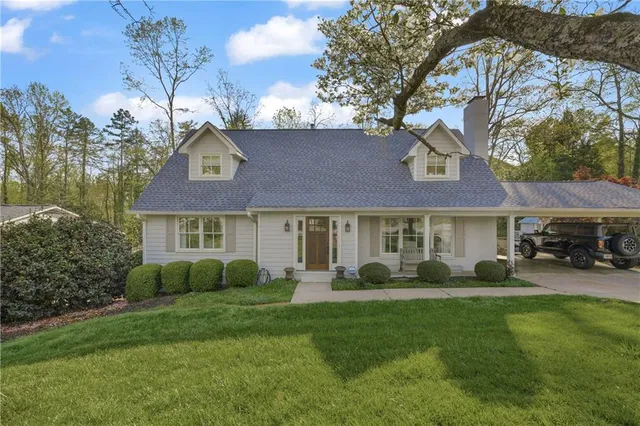 a view of a livingroom with furniture window and wooden floor