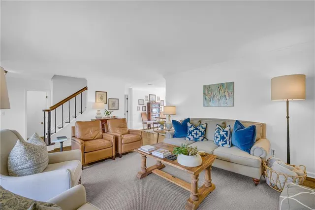 a view of a kitchen with stainless steel appliances granite countertop a sink refrigerator and microwave