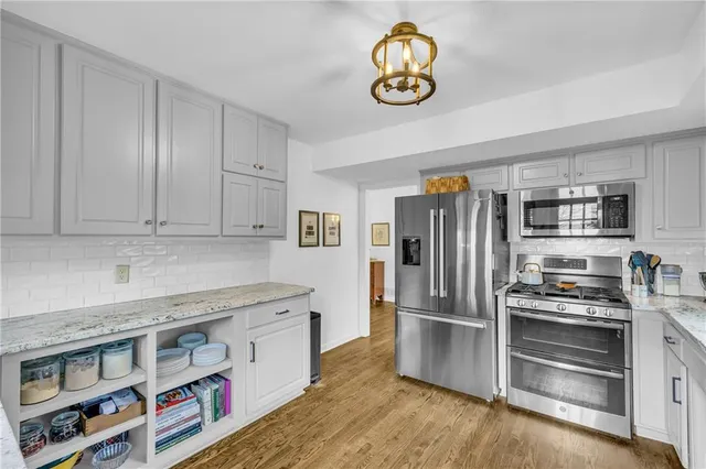 a living room with furniture a window and a table
