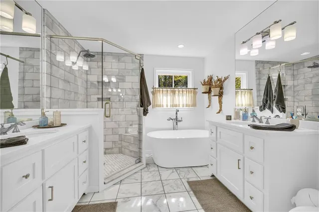 a bedroom with furniture and a wooden floor