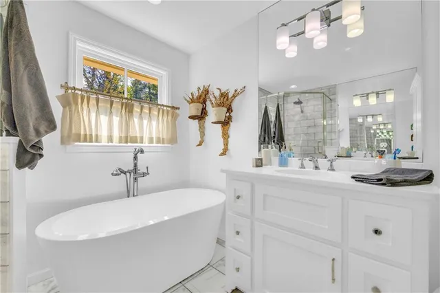 a bedroom with a bed and a wooden floor