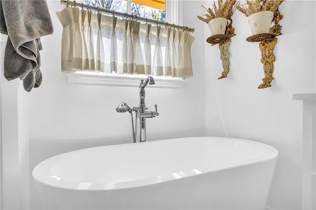 a kitchen with stainless steel appliances granite countertop a stove and a refrigerator