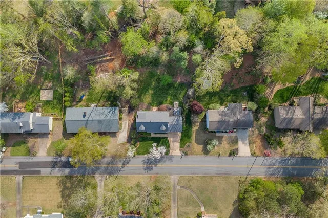 a aerial view of a house with table and chairs