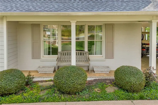 a aerial view of a house with a yard table and chairs