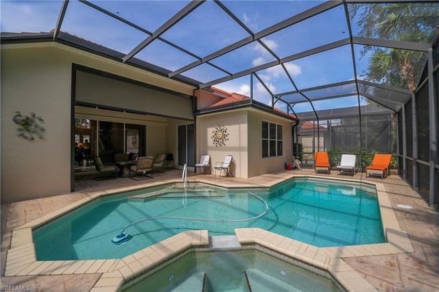 a view of a backyard with sitting area