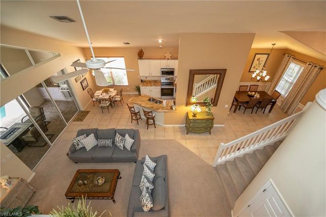a view of a livingroom with furniture and a fireplace
