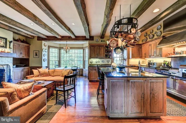 a bedroom with furniture and a fireplace