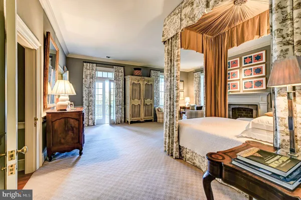 a living room with furniture a rug and a wooden floor