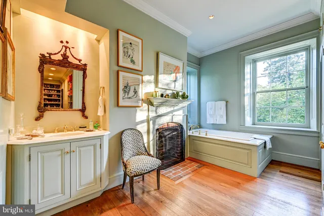 a kitchen with stainless steel appliances granite countertop a stove a sink and a wooden floors