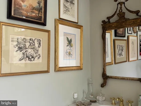 a living room with furniture and a book shelf
