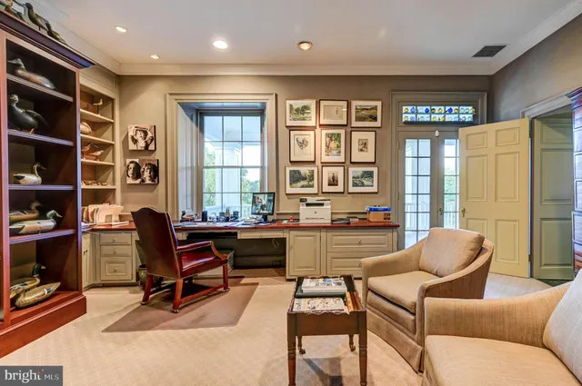 a view of a a dining room with furniture window and wooden floor