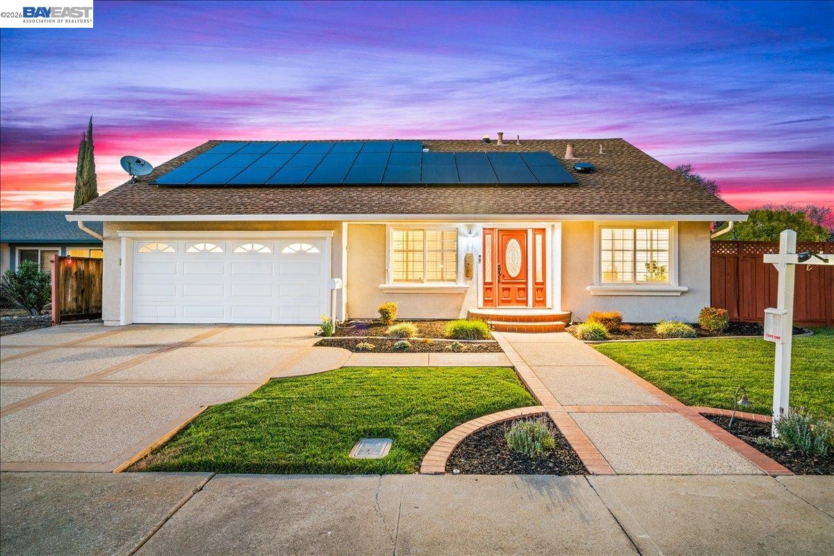 552 Hanover Street Livermore, CA 94551 - Photo 1 of 1 a view of yellow house with a yard in front of it
