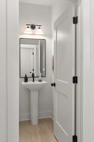 a bathroom with a sink a mirror and shower