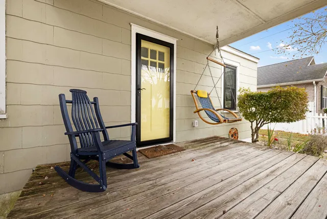 a view of workspace with wooden floor windows