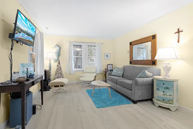 a living room with furniture and a window