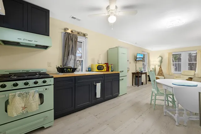a kitchen with a stove and cabinets
