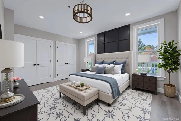 a spacious bedroom with a bed and a table