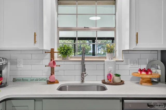 a view of a workspace with furniture and wooden floor