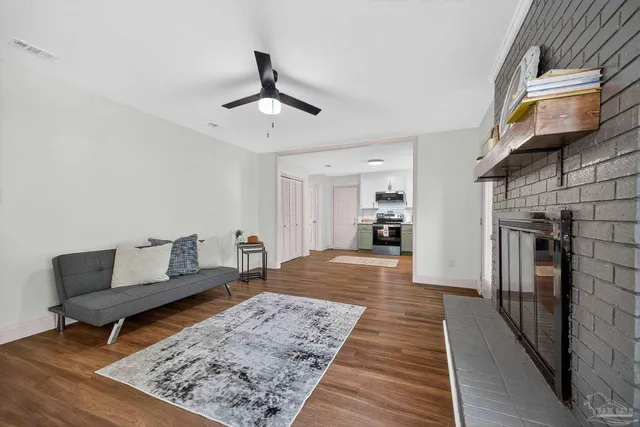 a bathroom view of a toilet and a shower