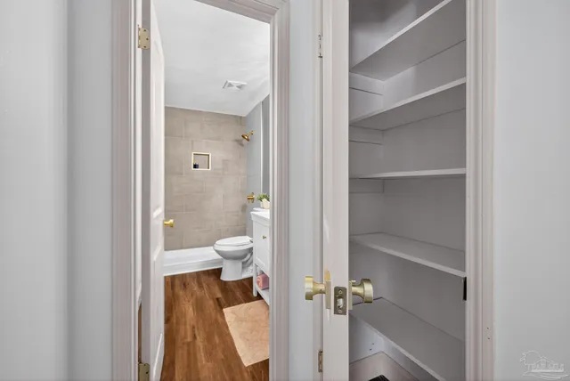 a view of a room with racks on the wall