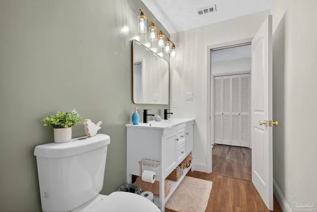 a bathroom with a sink toilet a bathtub and a vanity