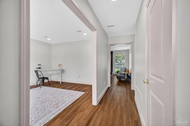a view of a livingroom with a couch and a window