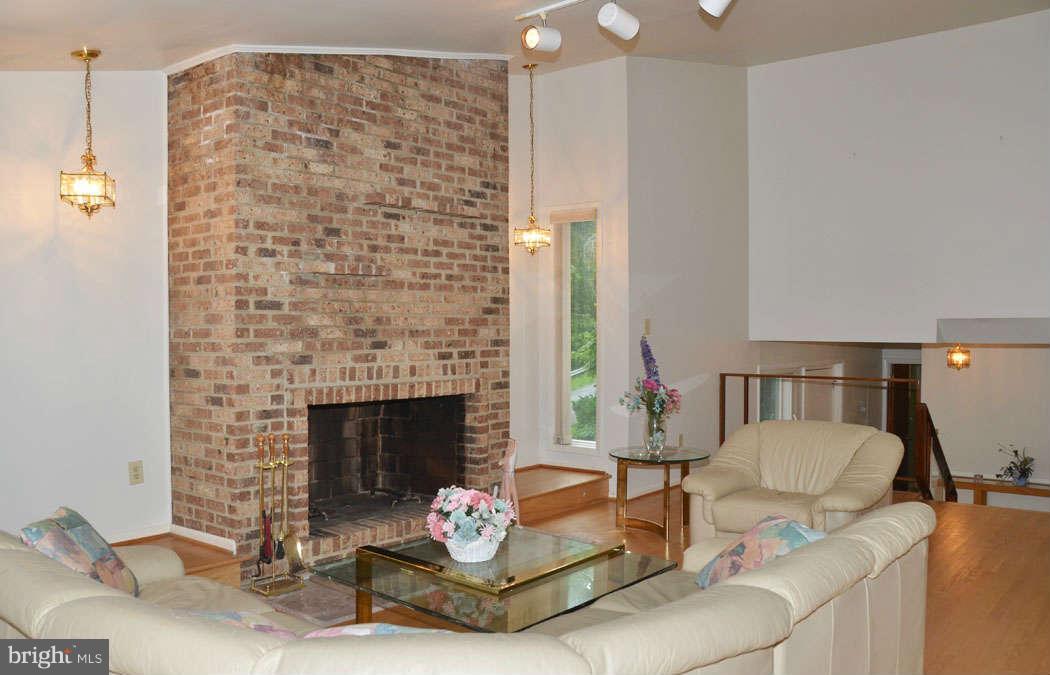 7134 River Road Bethesda, MD 20817 - Photo 9 of 29 Living Room with Floor to Ceiling Brick Fireplace