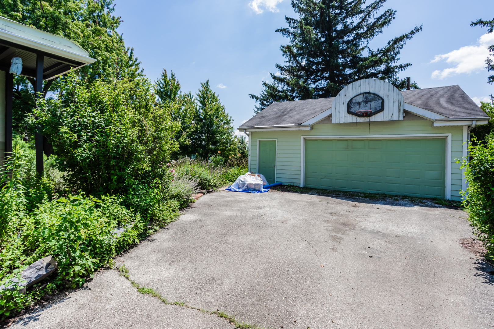 15W271 91st Street Burr Ridge, IL 60527 - Photo 26 of 30 a front view of a house with a yard and garage