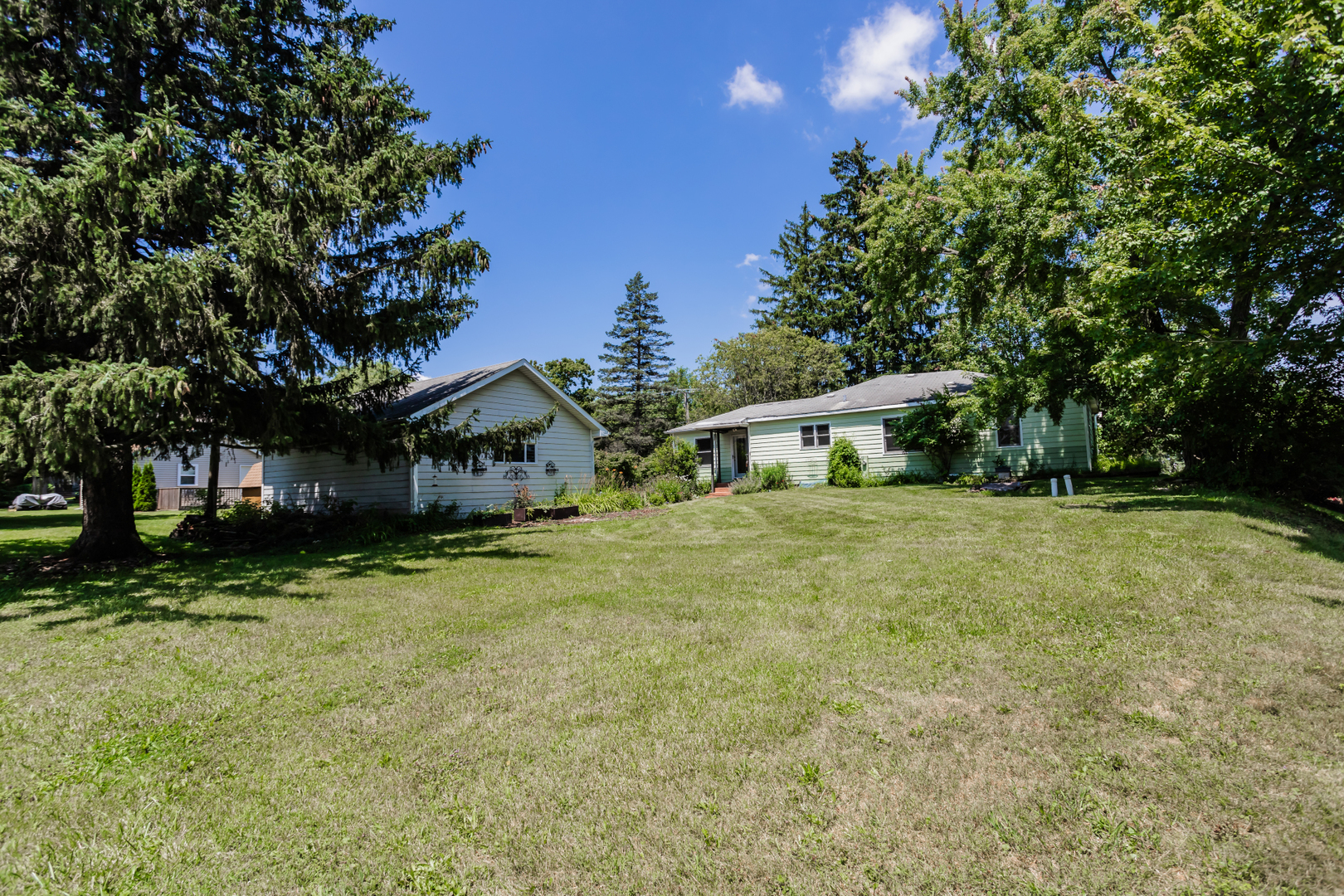15W271 91st Street Burr Ridge, IL 60527 - Photo 27 of 30 a yellow house sitting in middle of forest