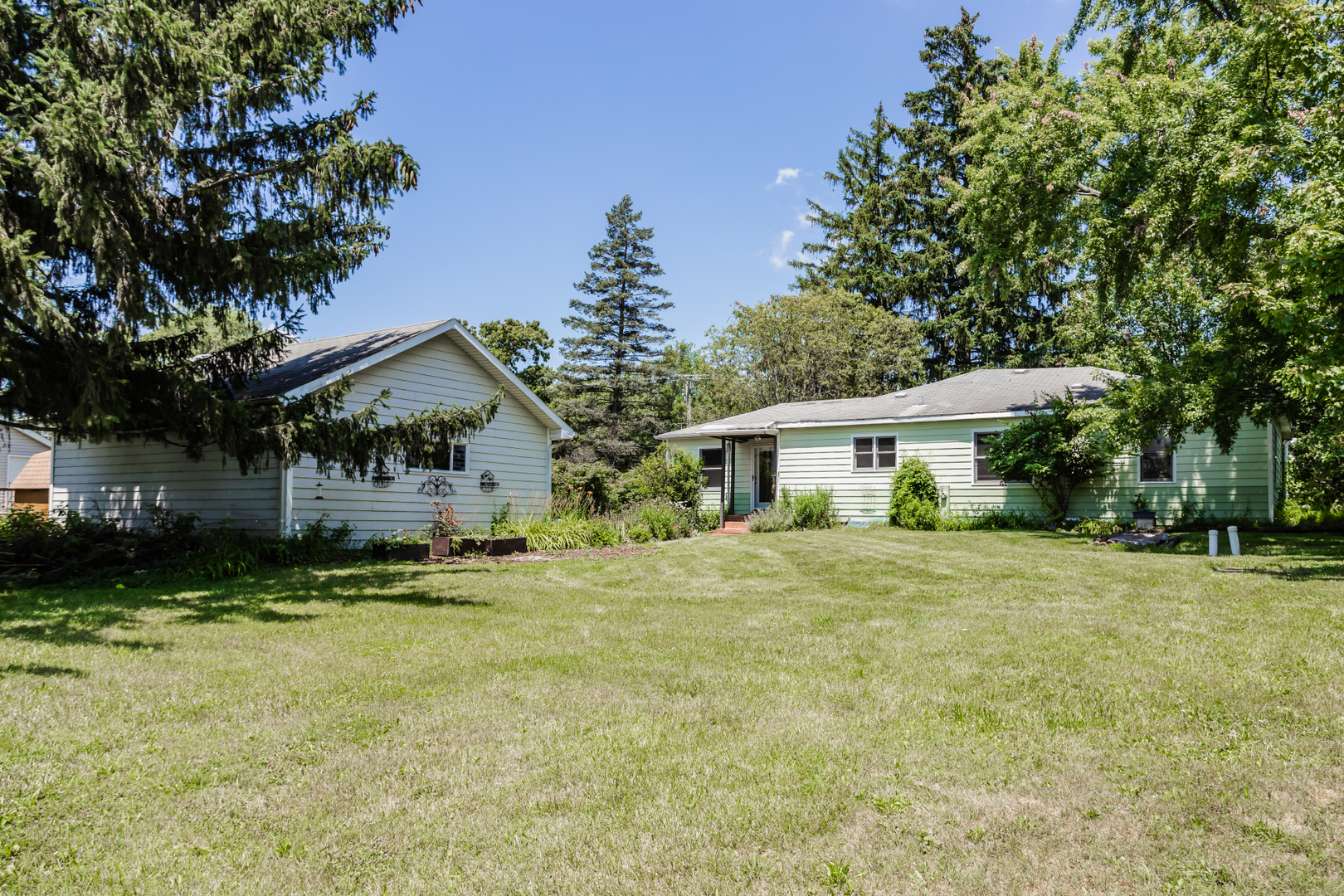 15W271 91st Street Burr Ridge, IL 60527 - Photo 28 of 30 a front view of a house with a yard and trees