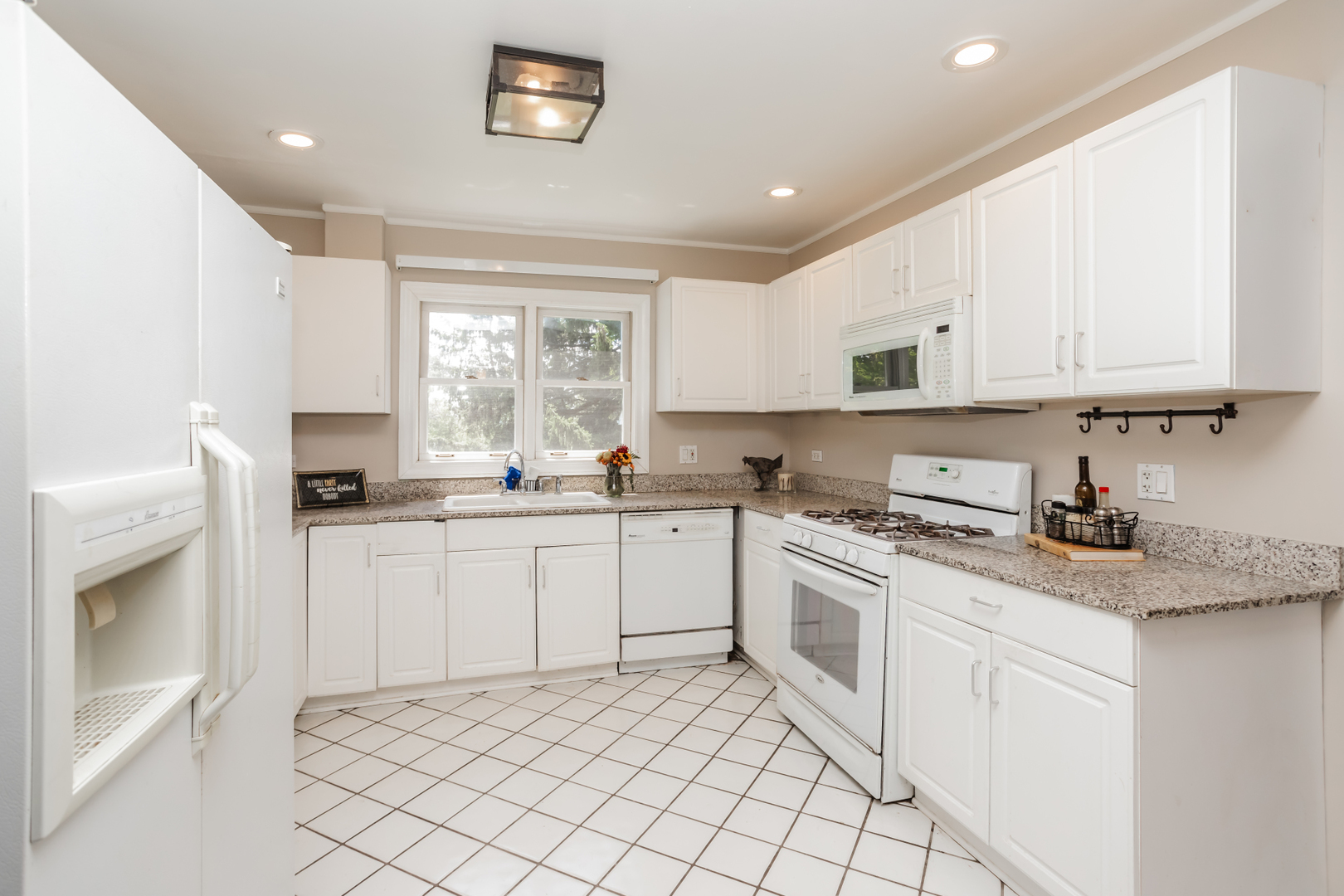 15W271 91st Street Burr Ridge, IL 60527 - Photo 6 of 30 a kitchen with granite countertop white cabinets white stainless steel appliances with a sink and dishwasher