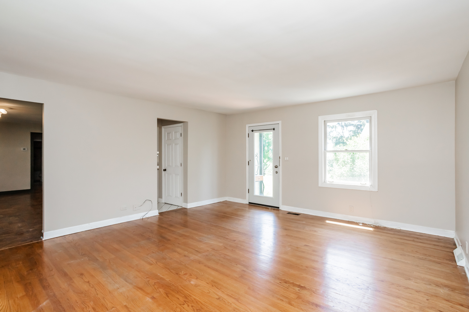 15W271 91st Street Burr Ridge, IL 60527 - Photo 10 of 30 an empty room with wooden floor and windows