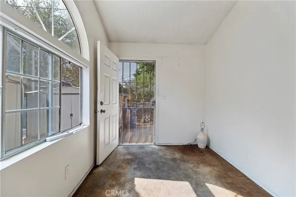 a living room with a couch and a window