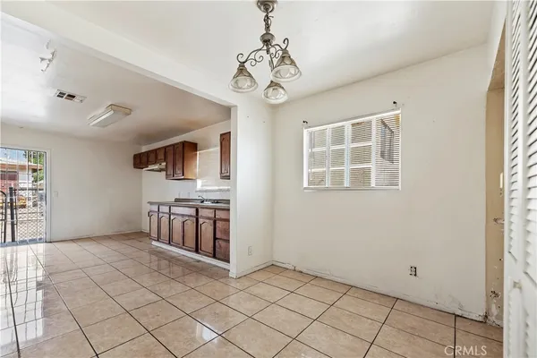 a view of an empty room and entryway