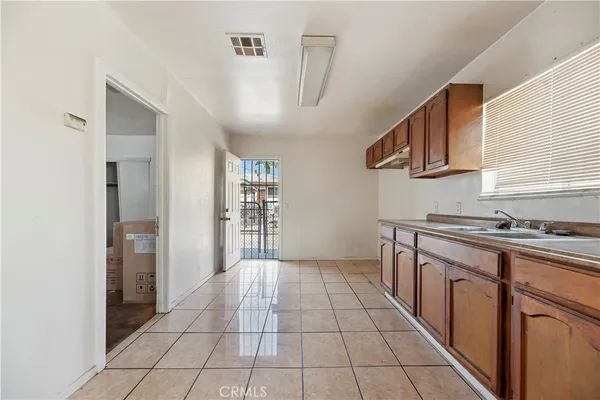 a kitchen with stainless steel appliances granite countertop a sink and cabinets